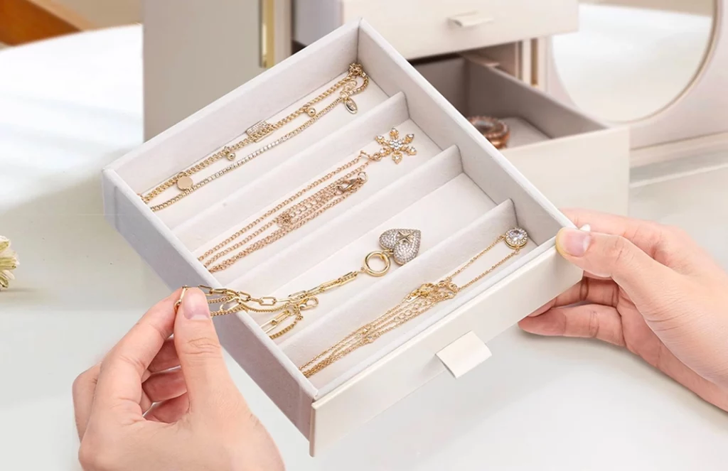 Close-up of velvet lining and magnetic glass door on jewelry box