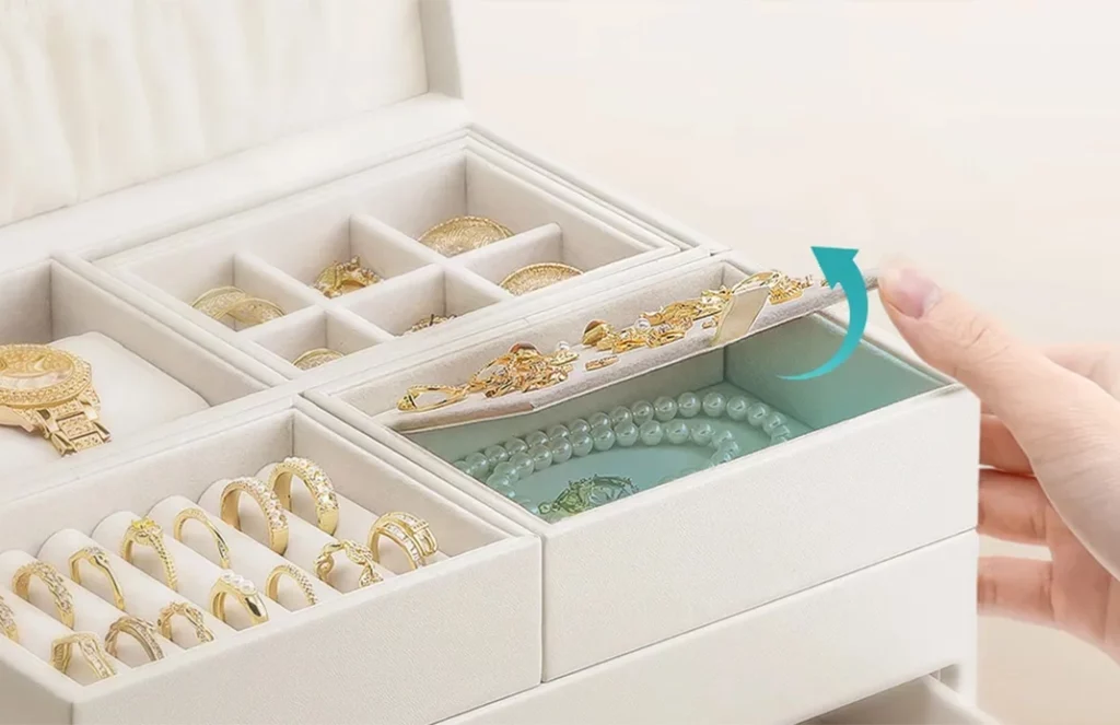 Gold metal clasp and soft velvet lining of luxury large jewelry box organizer for secure and scratch-free with dedicated spaces for every type of jewelry Oh Precious