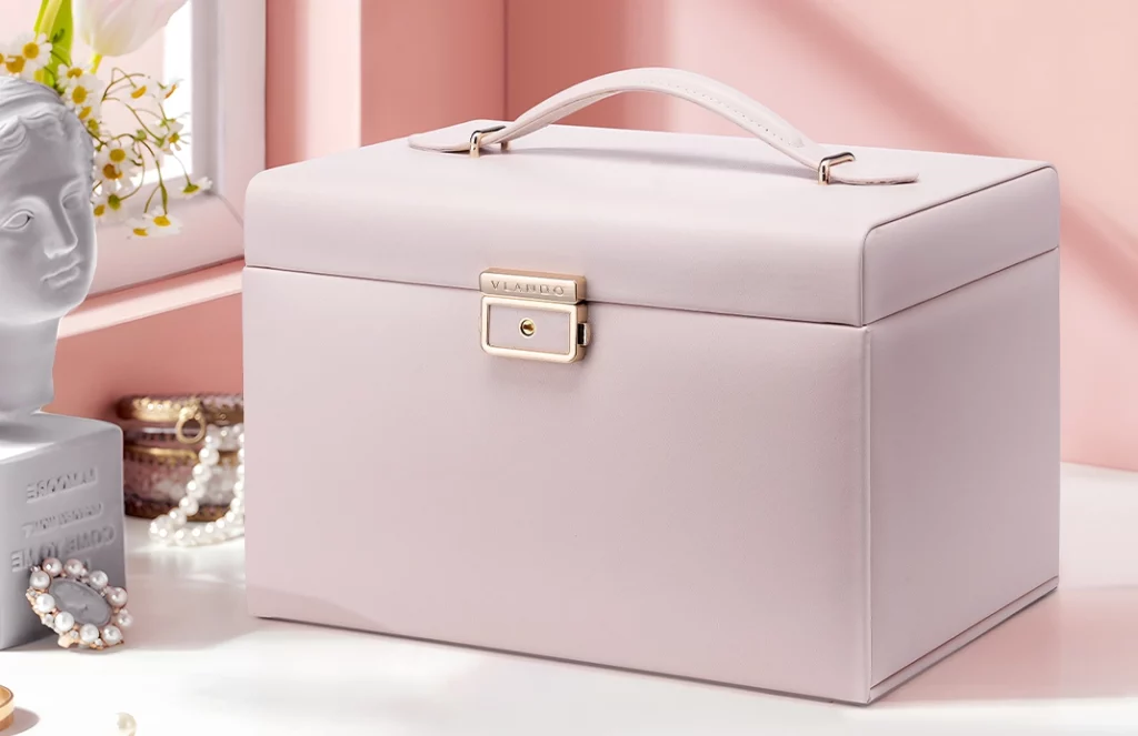 Jewelry box with lock and tassel key on vanity table with gold accents