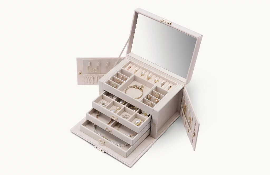 Open jewelry box with lock, mirror, drawers, and organized jewelry