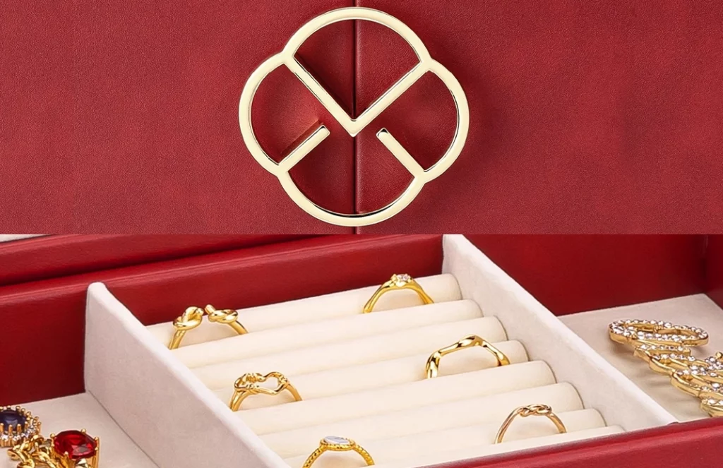 Gold hardware, sturdy hinges, and reinforced stitching on luxury large jewelry box with mirror