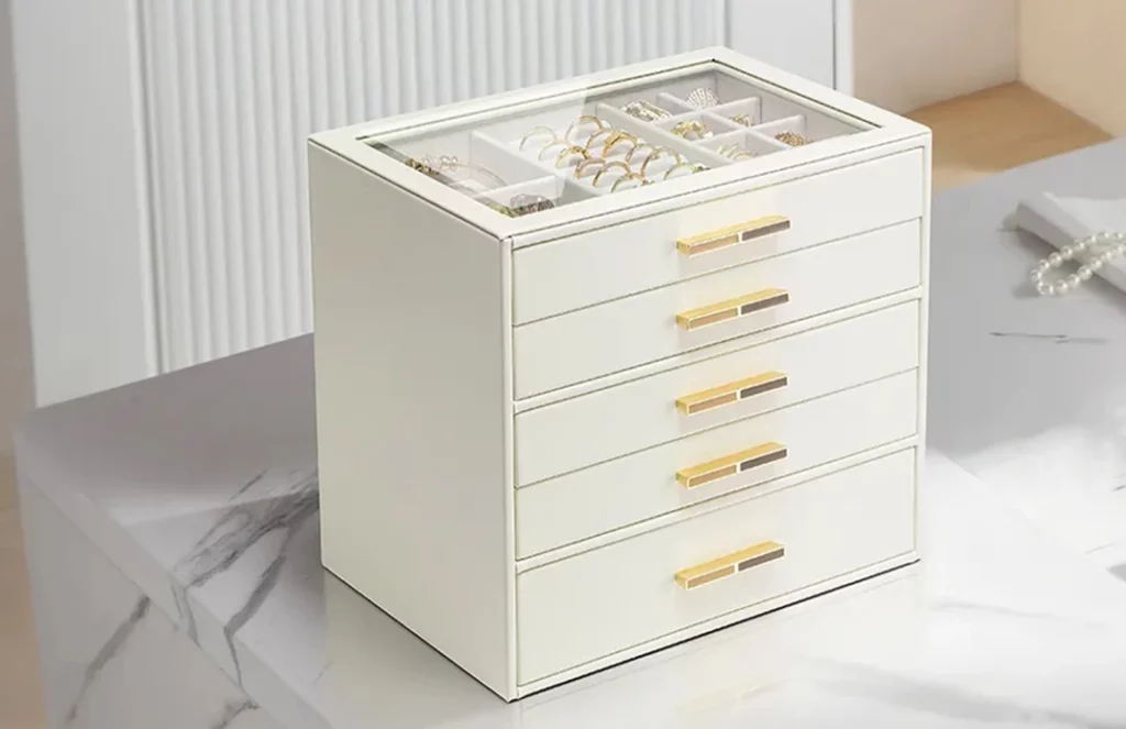 Close up of stitching and smooth drawer glide on a premium 5 drawer jewelry box