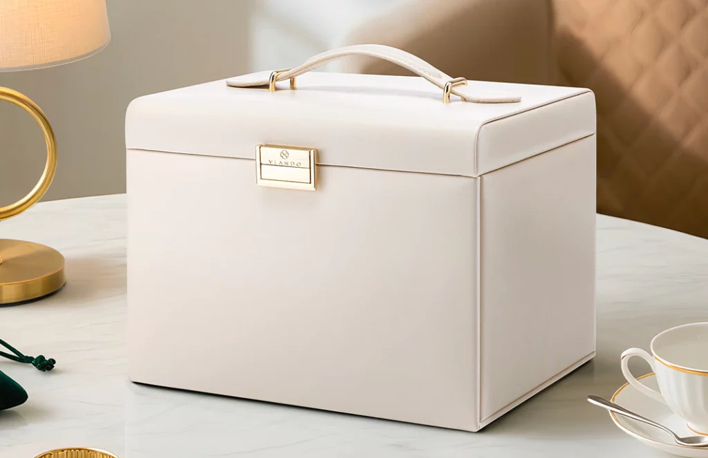 Portable jewelry box organizer displayed on vanity with elegant decor