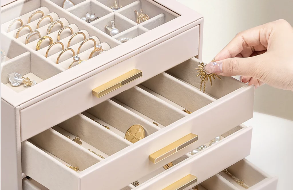 Open 5 drawer jewelry box showing ring rolls, earring tray and spacious sections