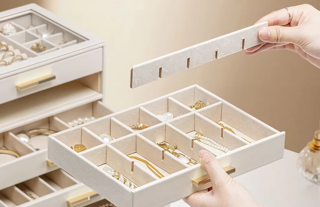 Removable drawer dividers creating custom sections in a 5 drawer jewelry organizer