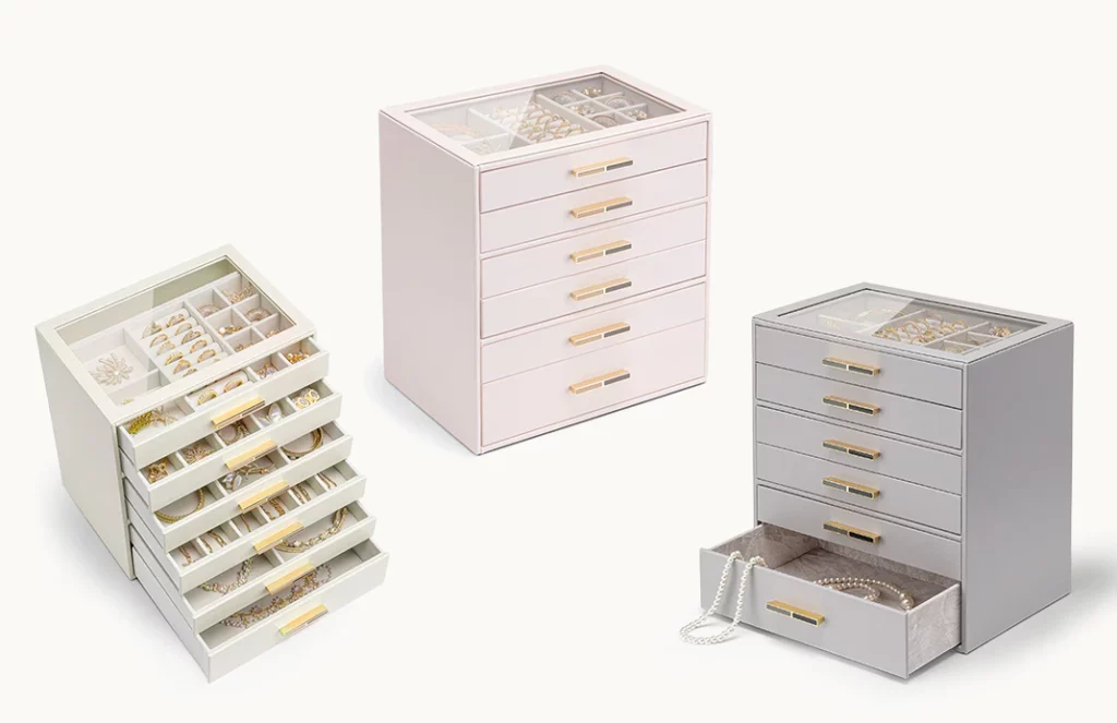 Ivory, pink, and grey 6-drawer jewelry boxes with gold handles, display-worthy design