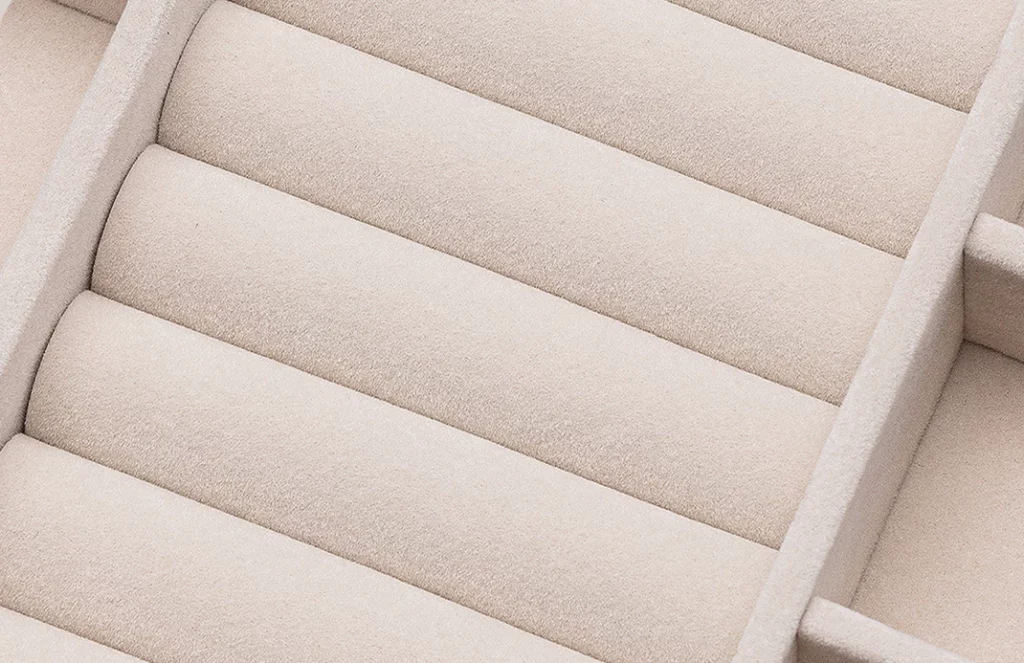 Close-up of velvet lining protecting rings in a 3-drawer organizer